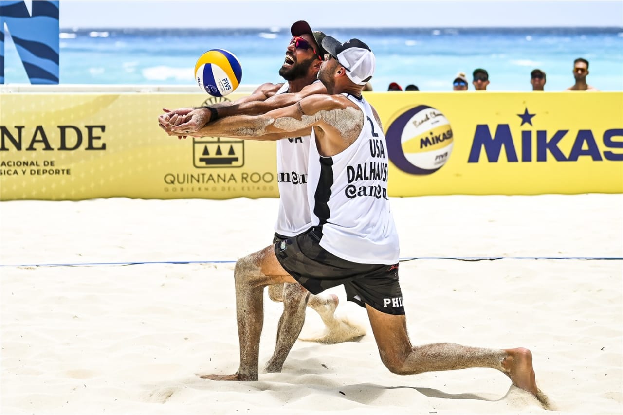 Nick Lucena and Phil Dalhausser cope with Adrian Carambula's skyball serve in Cancun, Mexico